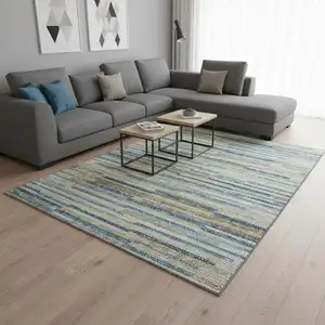 Photo of Blue Ivory And Gold Abstract Washable Area Rug With UV Protection