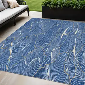Photo of Blue Ivory And Gold Abstract Washable Indoor Outdoor Area Rug
