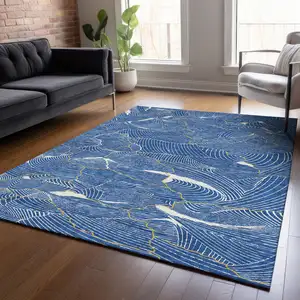 Photo of Blue Ivory And Gold Abstract Washable Indoor Outdoor Area Rug
