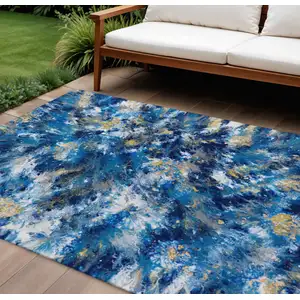 Photo of Blue Ivory And Gold Abstract Washable Indoor Outdoor Area Rug