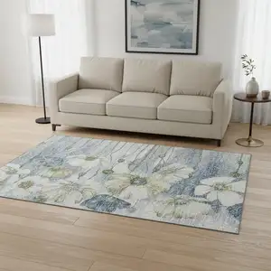Photo of Blue Ivory And Gold Floral Washable Area Rug With UV Protection