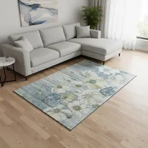 Photo of Blue Ivory And Gold Floral Washable Area Rug With UV Protection