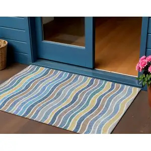 Photo of Blue Ivory And Gold Striped Washable Indoor Outdoor Area Rug