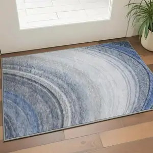Photo of Blue Ivory And Gray Ombre Washable Area Rug With UV Protection