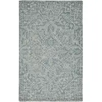 Photo of Blue Ivory And Green Wool Floral Tufted Handmade Stain Resistant Area Rug