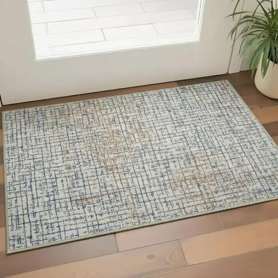 Blue Ivory And Orange Abstract Washable Area Rug Photo 1