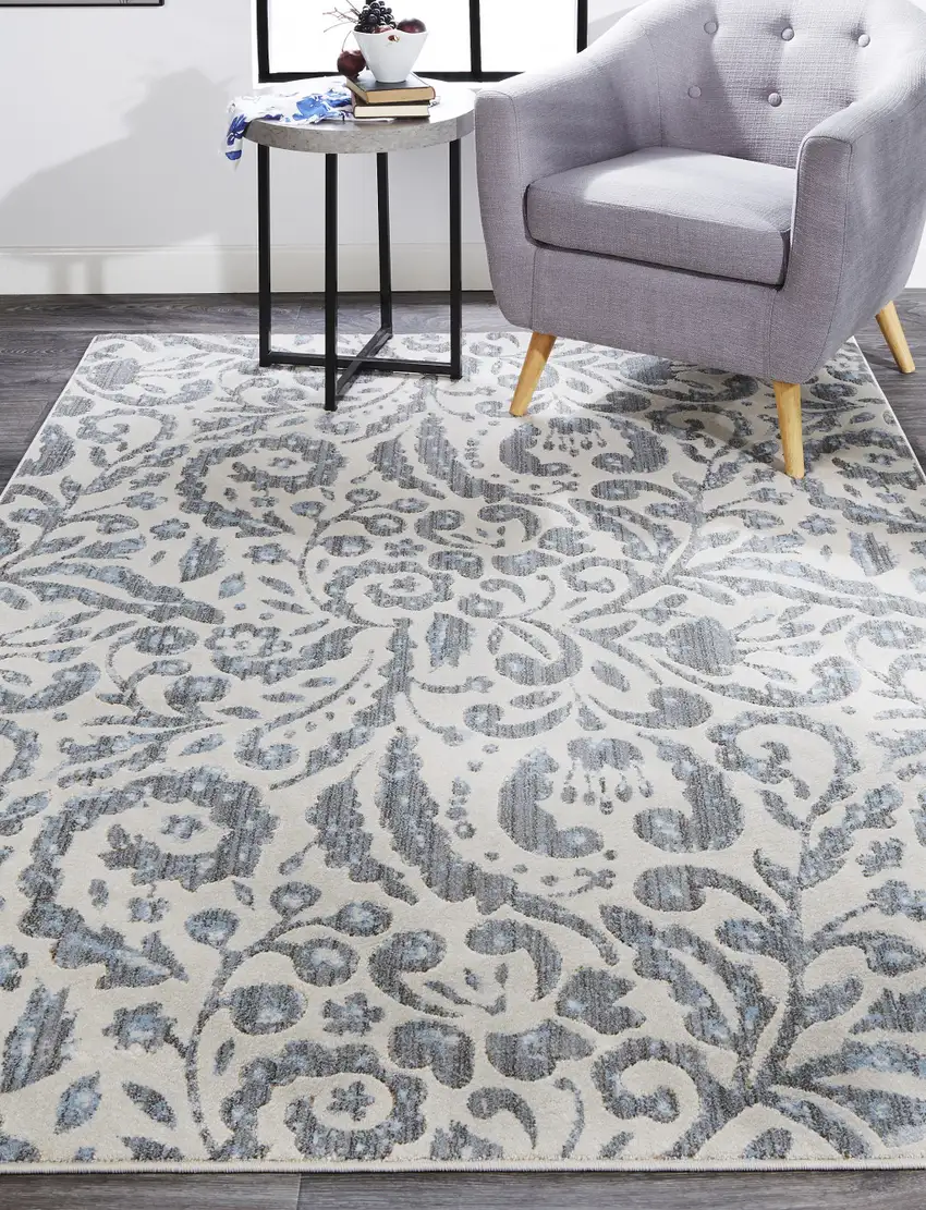 Blue Ivory And Tan Floral Distressed Stain Resistant Area Rug Photo 7