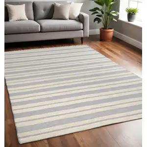 Photo of Blue Ivory And Tan Striped Dhurrie Hand Woven Stain Resistant Area Rug