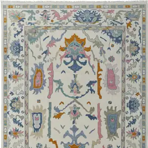Photo of Blue Ivory and Pink Wool Floral Hand Knotted Area Rug With Fringe