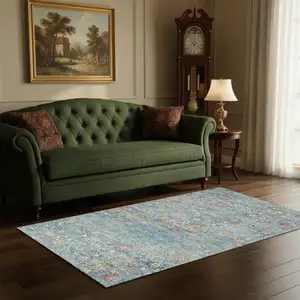 Photo of Blue Orange And Gold Floral Medallion Washable Area Rug With UV Protection