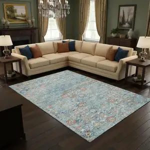 Photo of Blue Orange And Gold Floral Medallion Washable Area Rug With UV Protection