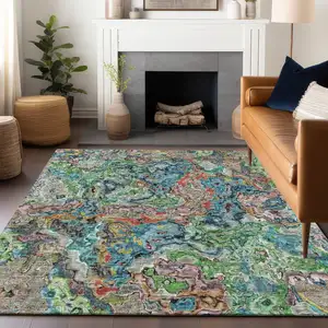 Photo of Blue Orange And Green Abstract Washable Area Rug With UV Protection