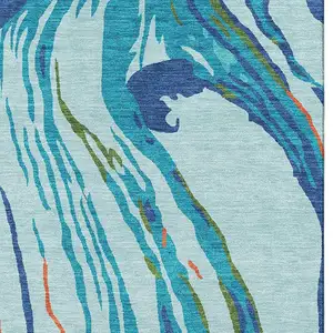 Photo of Blue Orange And Green Abstract Washable Area Rug With UV Protection