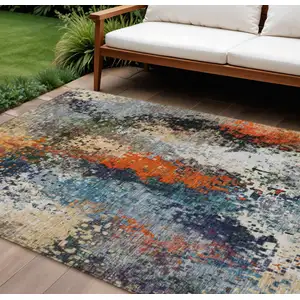 Photo of Blue Orange And Ivory Abstract Washable Indoor Outdoor Area Rug