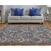 Photo of Blue Orange And Ivory Floral Power Loom Area Rug With Fringe