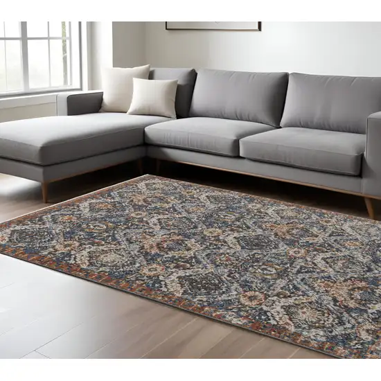 Blue Orange And Ivory Floral Power Loom Area Rug With Fringe Photo 1