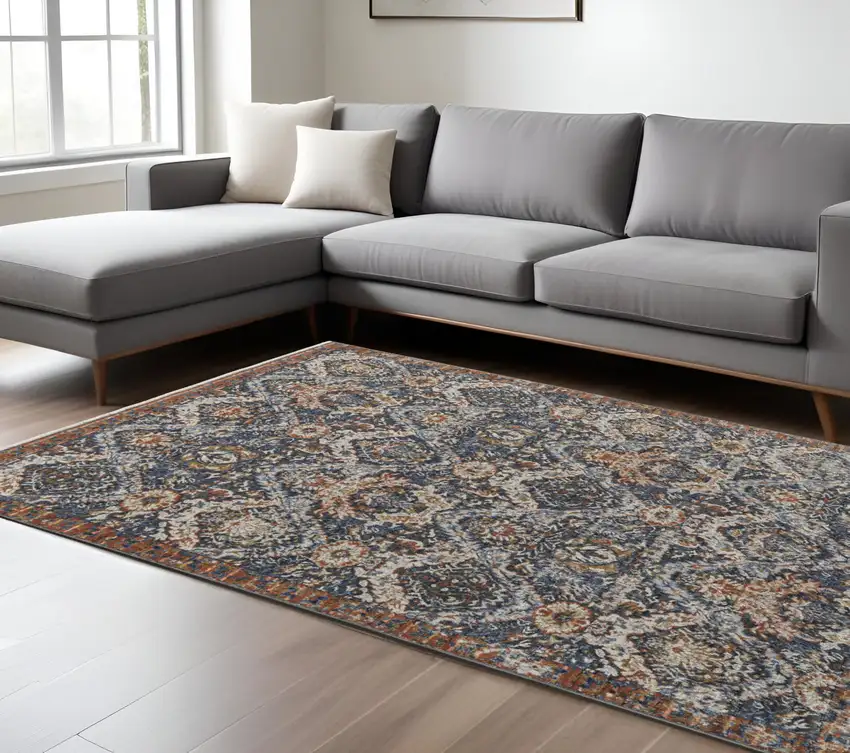 Blue Orange And Ivory Floral Power Loom Area Rug With Fringe Photo 1