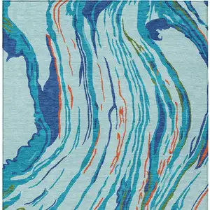 Photo of Blue Pink And Green Abstract Washable Indoor Outdoor Area Rug