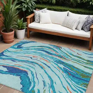Photo of Blue Pink And Green Abstract Washable Indoor Outdoor Area Rug
