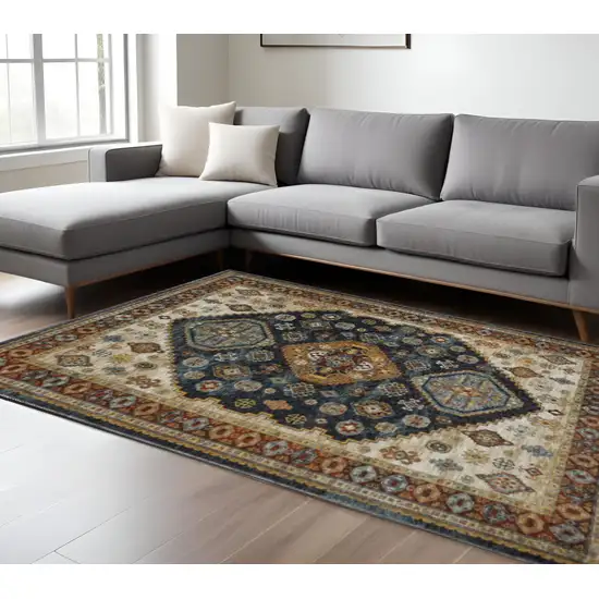 Blue Red Beige Orange Gold And Tan Oriental Power Loom Stain Resistant Area Rug With Fringe Photo 1