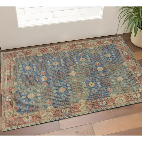 Blue Red And Beige Floral Medallion Hand Woven Distressed Area Rug Photo 1