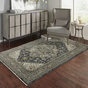 Photo of Blue Taupe Grey Green Rust Tan Beige And Gold Oriental Power Loom Stain Resistant Area Rug With Fringe