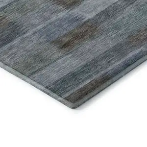 Photo of Blue Teal And Brown Striped Washable Area Rug With UV Protection