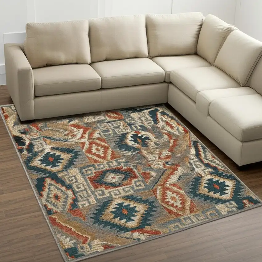 Blue Teal Grey Orange Gold Ivory And Rust Geometric Power Loom Stain Resistant Area Rug Photo 1