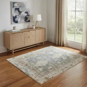 Photo of Blue Yellow And Cream Floral Medallion Distressed Washable Area Rug