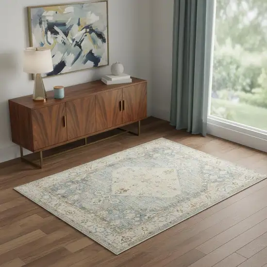 Blue Yellow And Cream Floral Medallion Distressed Washable Area Rug Photo 1