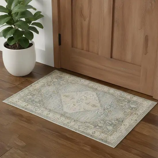 Blue Yellow And Cream Floral Medallion Distressed Washable Area Rug Photo 1