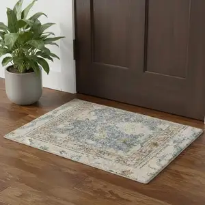 Photo of Blue Yellow And Cream Floral Medallion Distressed Washable Area Rug