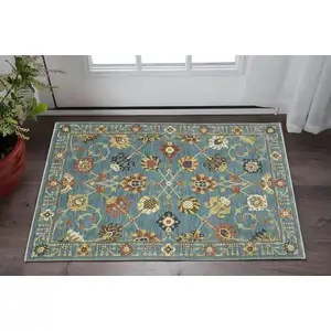 Photo of Blue Yellow And Dark Orange Oriental Area Rug With Fringe
