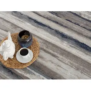 Photo of Blue and Beige Distressed Stripes Area Rug