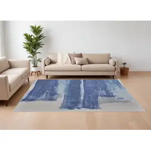 Photo of Blue and Ivory Abstract Hand Tufted Area Rug