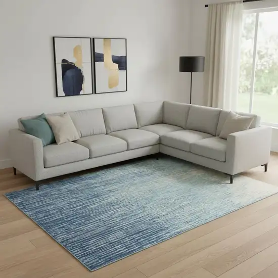 Blue and Ivory Abstract Power Loom Area Rug Photo 1