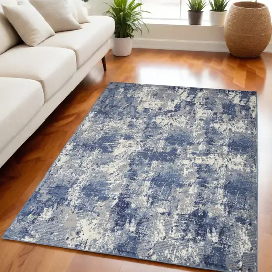 Blue and Ivory Abstract Power Loom Area Rug Photo 1