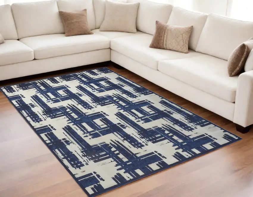Blue and Ivory Abstract Power Loom Area Rug Photo 1