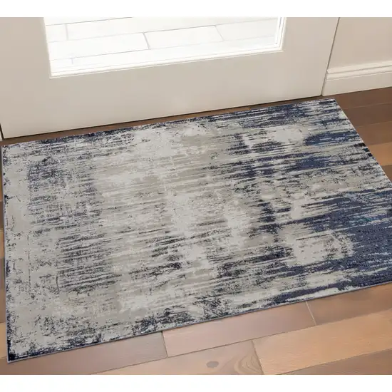Tan And Blue Abstract Distressed Area Rug Photo 1