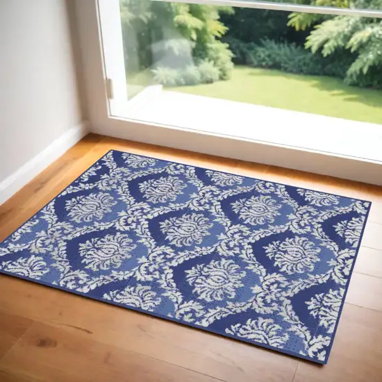 Blue and Ivory Damask Distressed Area Rug Photo 1
