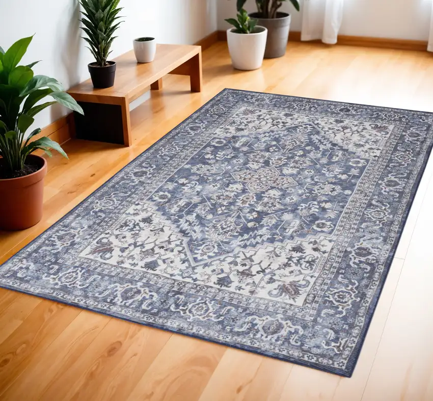 Blue and Ivory Floral Medallion Power Loom Distressed Area Rug Photo 1