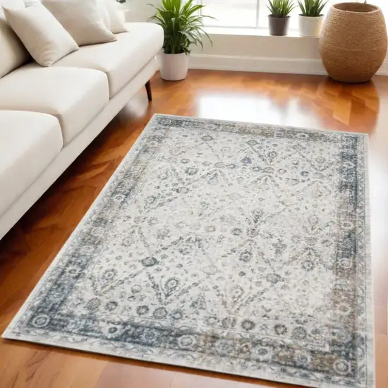 Blue and Ivory Floral Medallion Power Loom Distressed Washable Area Rug Photo 1
