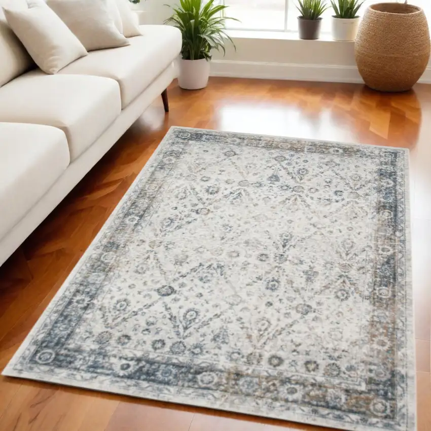 Blue and Ivory Floral Medallion Power Loom Distressed Washable Area Rug Photo 1