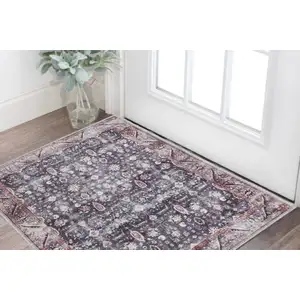 Photo of Blue and Ivory Floral Power Loom Distressed Washable Non Skid Area Rug