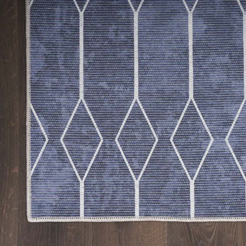 5' X 7' Blue and Ivory Geometric Power Loom Washable Area Rug Photo 7
