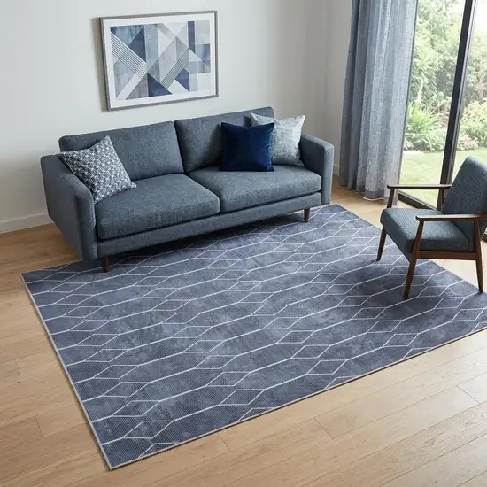 5' X 7' Blue and Ivory Geometric Power Loom Washable Area Rug Photo 1