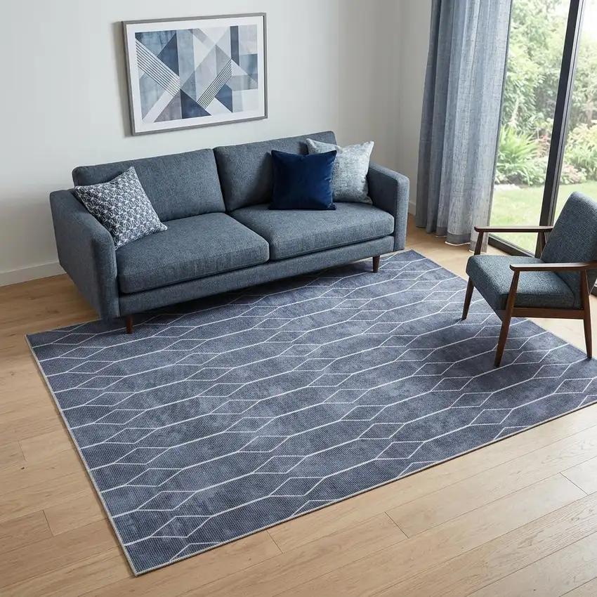 5' X 7' Blue and Ivory Geometric Power Loom Washable Area Rug Photo 1