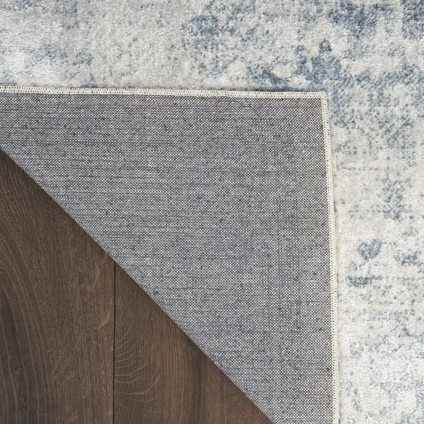 Blue and Ivory Oriental Power Loom Distressed Area Rug Photo 9