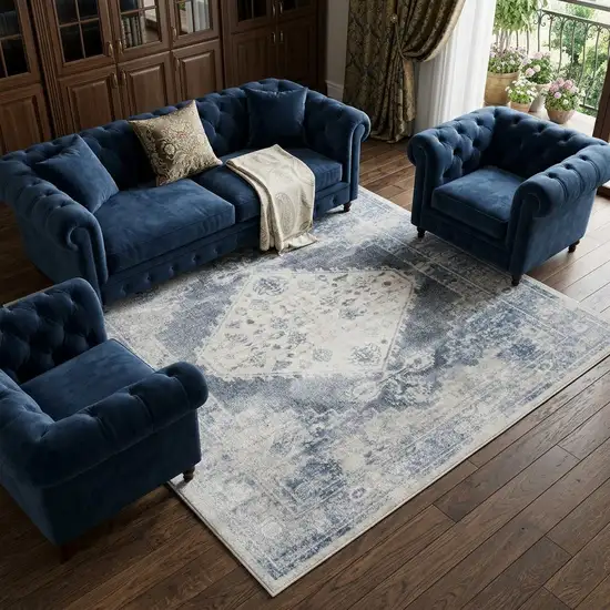 Blue and Ivory Oriental Power Loom Distressed Area Rug Photo 1