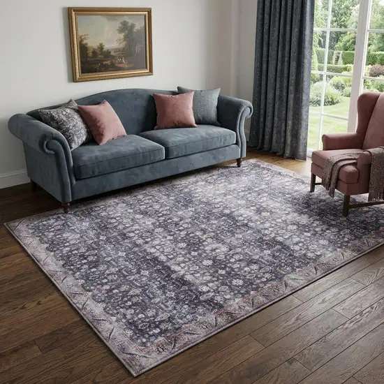 5' X 7' Blue and Ivory Oriental Power Loom Distressed Washable Non Skid Area Rug Photo 1